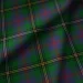 Dark green tartan plaid fabric with intersecting red, yellow, and thin white stripes; the classic check pattern feels bold and traditional.