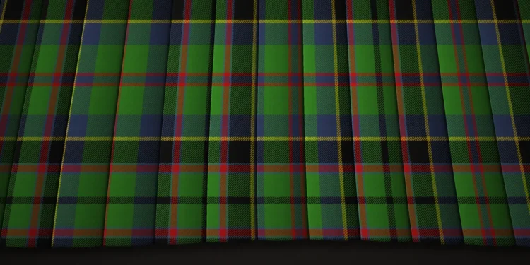Close-up of dark green and navy tartan fabric, crossed by fine red and yellow lines in a repeating plaid pattern with subtle folds and a traditional feel.
