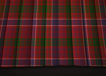 Red-and-green plaid fabric hangs in deep vertical folds, with fine blue and yellow lines crossing the tartan pattern for a rich, formal look.
