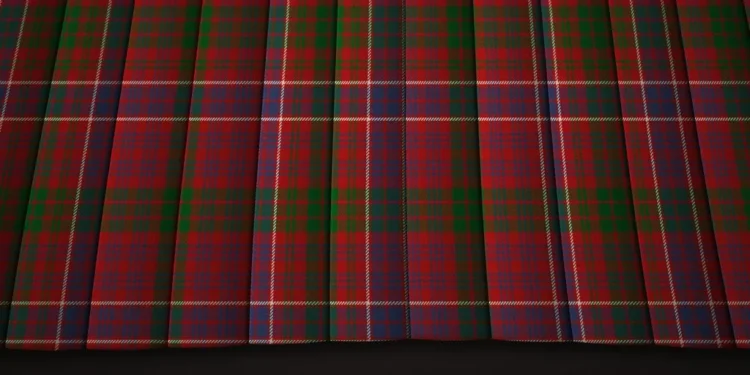 Red-and-green plaid fabric hangs in deep vertical folds, with fine blue and yellow lines crossing the tartan pattern for a rich, formal look.